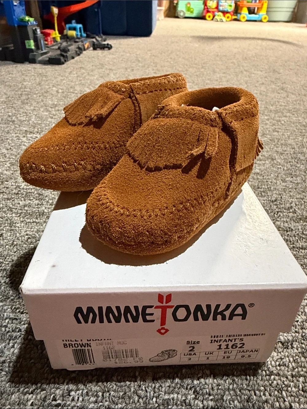 Minnetonka Kids Suede Fringe Moccasins in Brown